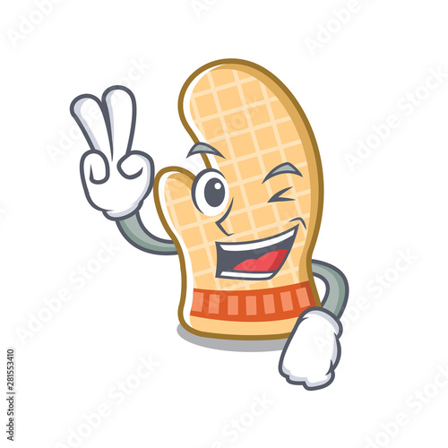 Two finger oven glove placed mascot cooking table