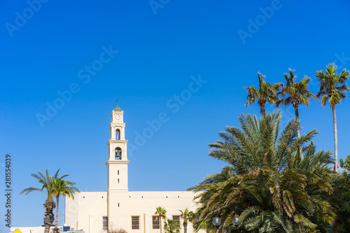 An old tower in Jaffa with palm trees in the background