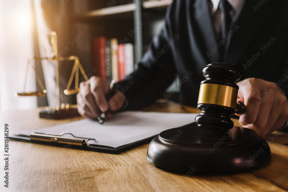 justice and law concept.Male judge in a courtroom on wooden table and Counselor or Male lawyer working in office. Legal law, advice and justice concept. justice and law concept.Male judge in a courtroom on wooden table and Counselor or Male lawyer working in office. Legal law, advice and justice concept.