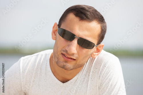 Portrait Of Young Handsome Man Smiling Outdoor