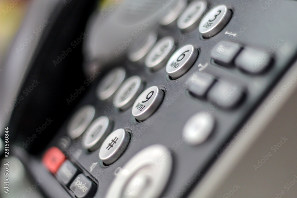 Office telephone for communications with the background blurred Office telephone for communications with the background blurred