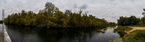 river in the forest in autumn panorama