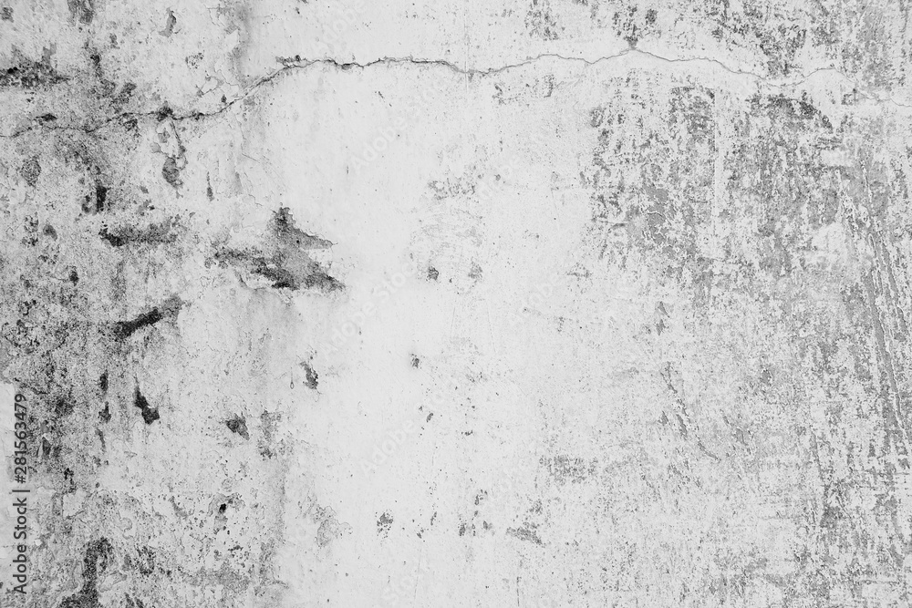 Fototapeta premium Close-up of White cement wall peeled paint caused by water and sunlight. Peel wall of White house paint with black stain. Black and White of Texture background.
