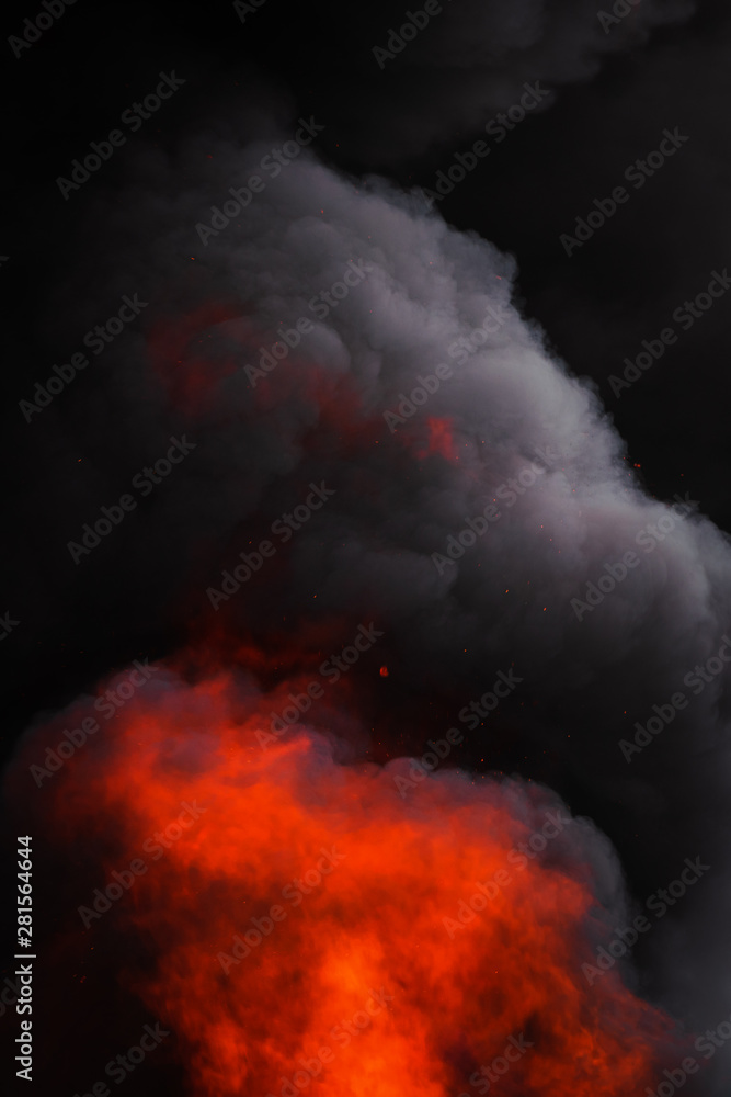 Flames strong red fire, motion blur dramatic clouds of black smoke covered sky