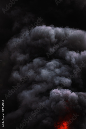Black motion clouds of strong fire smoke covered sky
