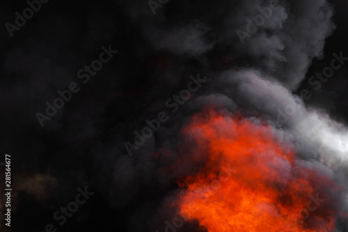 Flames strong red fire, dramatic clouds motion blur of black smoke covered sky
