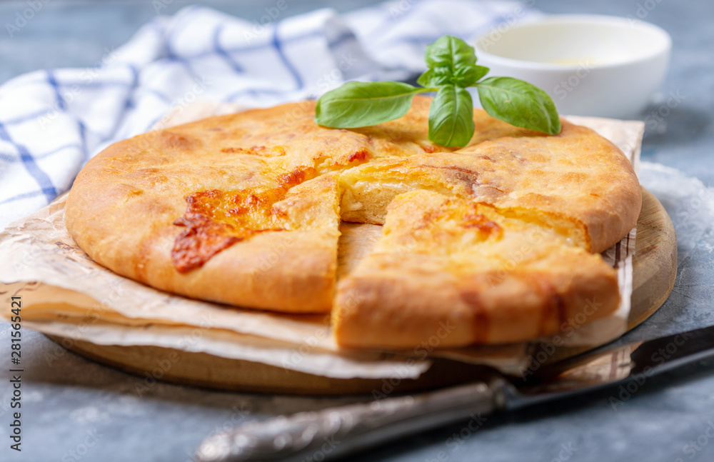 Closed cheese pie (khachapuri) close-up. Closed cheese pie (khachapuri) close-up.