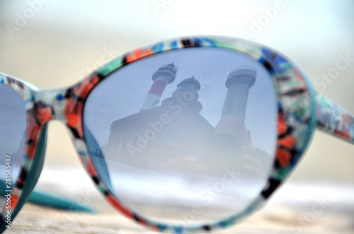 View of a Lighthouse in Fuerteventura Through Sunglasses Reflection © Jordi