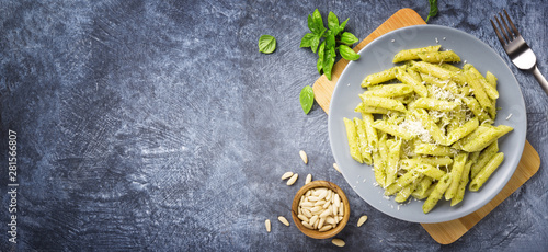Penne pasta with basil pesto, genoese pesto. Top view, space for text. photo