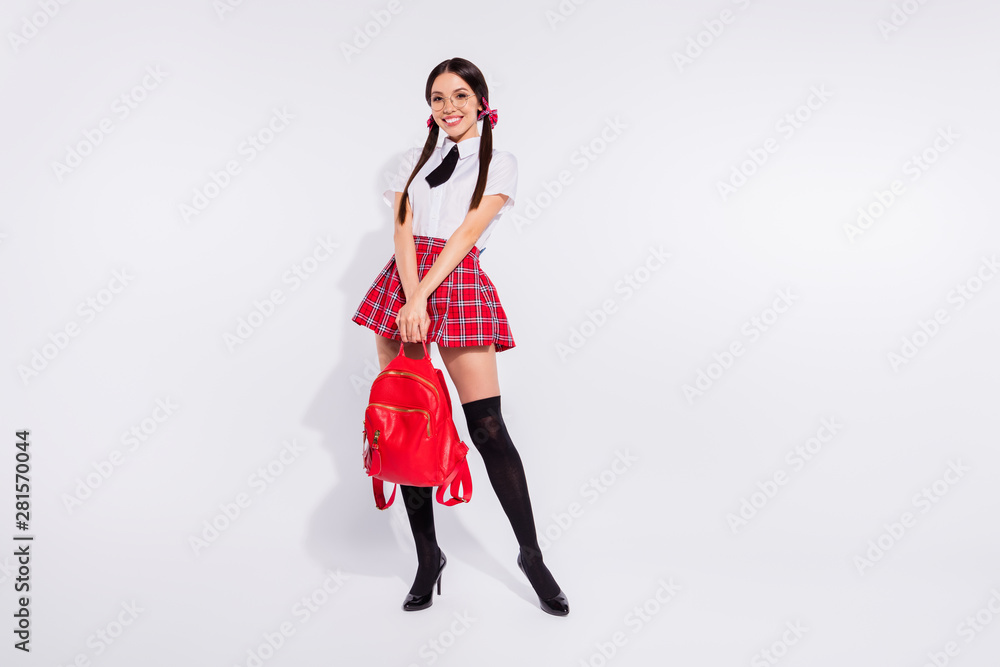 Full length body size view portrait of her she nice attractive slim fit thin lovely cheerful cheery positive girl wearing checkered skirt shadow isolated on gray light white background Full length body size view portrait of her she nice attractive slim fit thin lovely cheerful cheery positive girl wearing checkered skirt shadow isolated on gray light white background