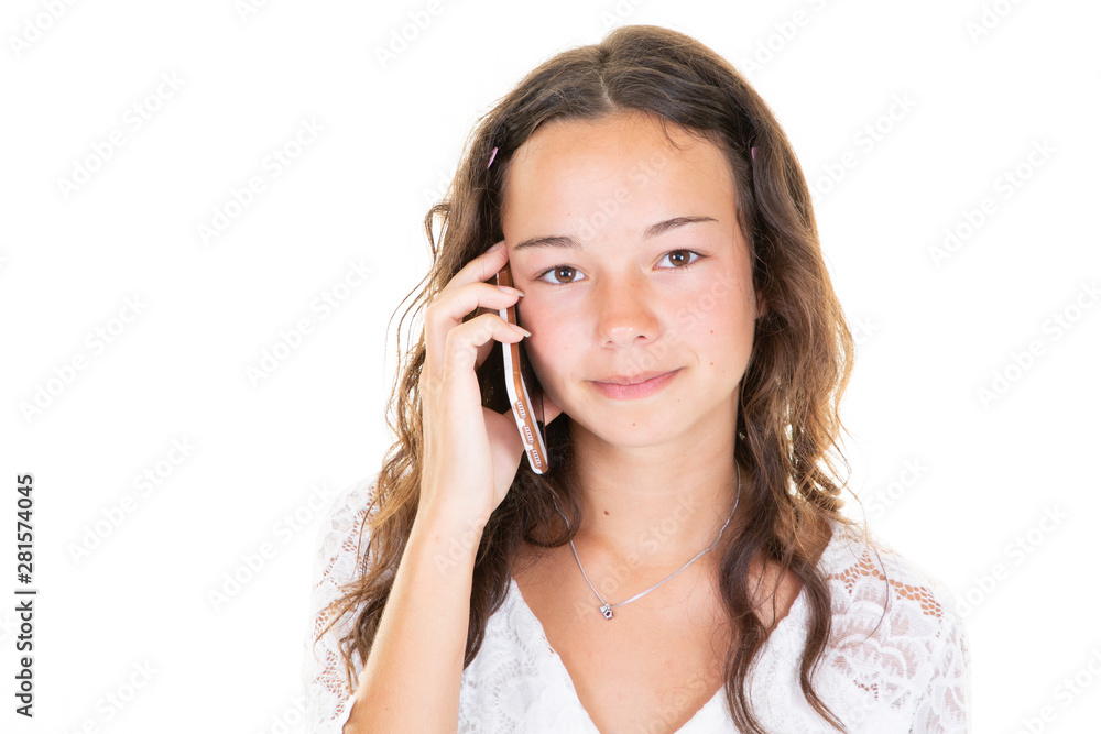 Beautiful teenager young girl talking on the phone in the Studio in white background Beautiful teenager young girl talking on the phone in the Studio in white background