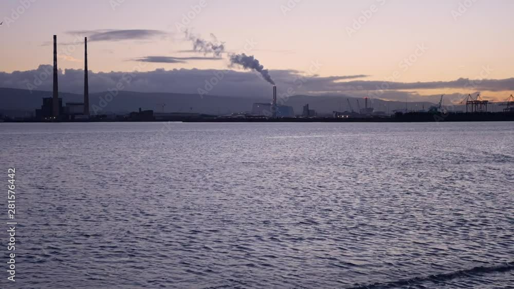 Iconic view of Dublin's dockland skyline at Poolbeg, seen from Bull Island at dusk Iconic view of Dublin's dockland skyline at Poolbeg, seen from Bull Island at dusk