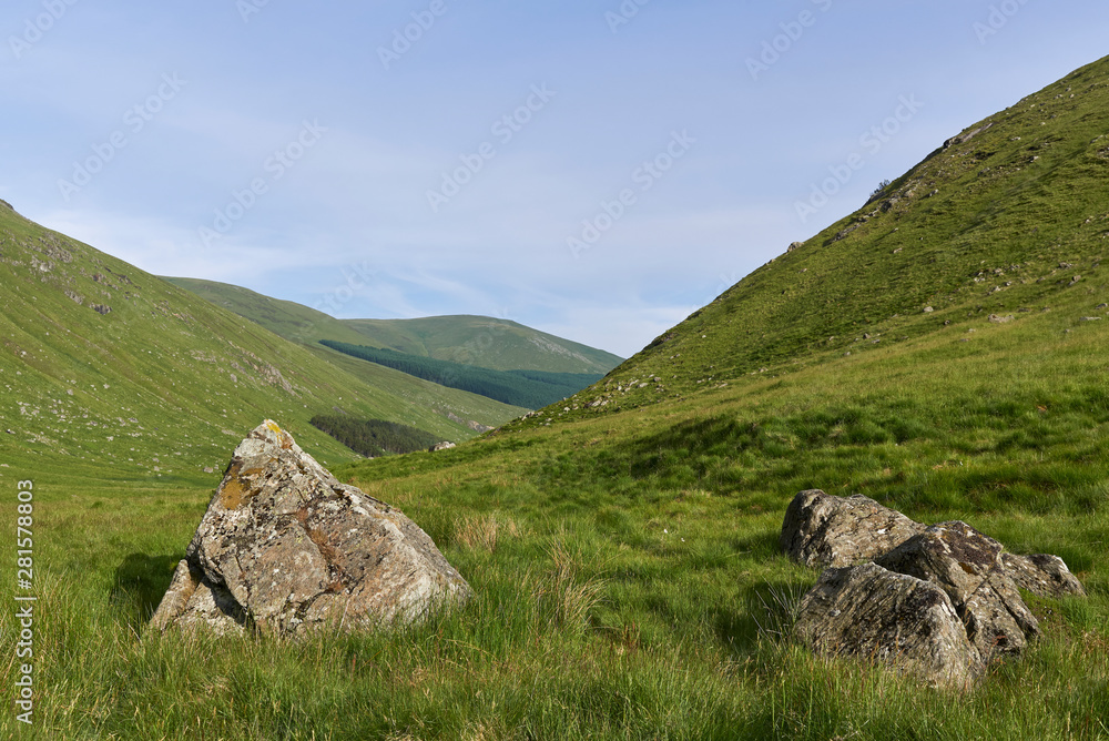 Two Boulders, possibly Glacial Erratics lie at the Head of the Valley in Glen Doll, part of the Cairngorm National Park in The Highlands of Scotland.