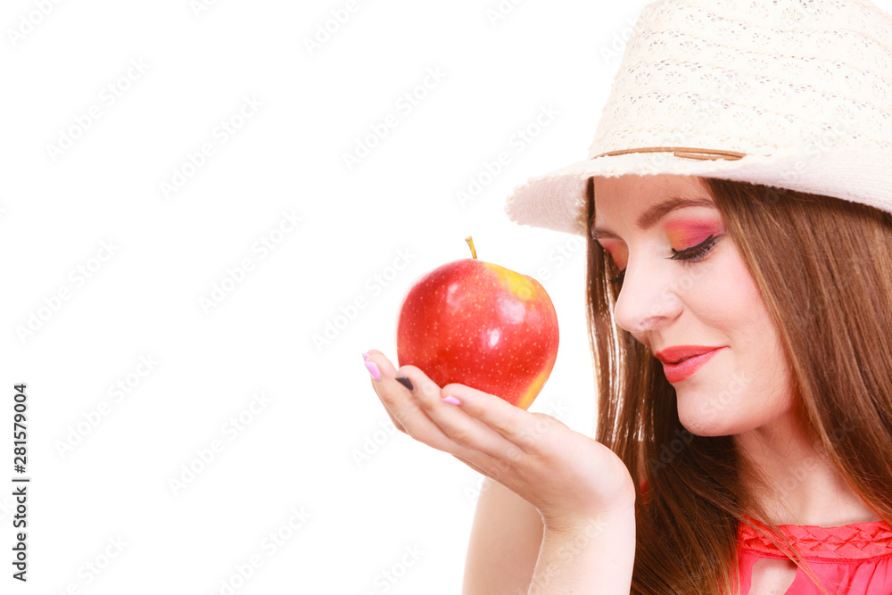 Woman summer hat colorful makeup holds apple fruit Woman summer hat colorful makeup holds apple fruit