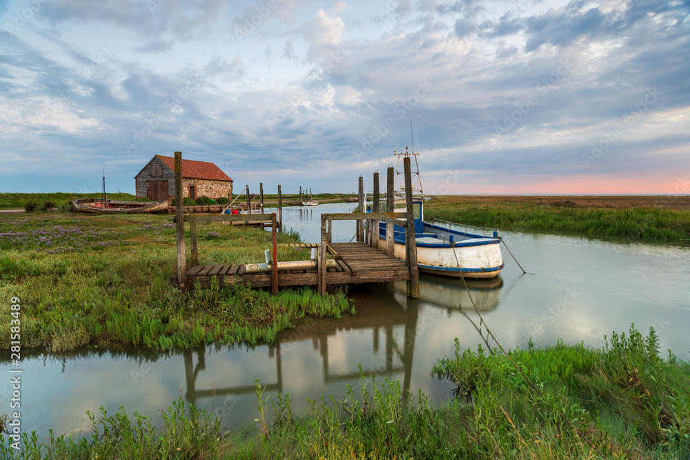 Fototapeta premium Dawn over the old harbour at Thornham