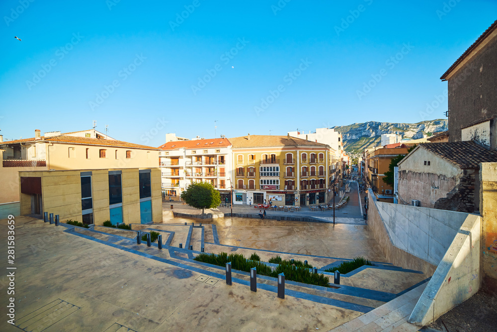 DENIA, SPAIN - JUNE 19, 2019: Panoramic view of cafes on old street in a beautiful town Denia.