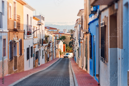 Old town of Denia with narrow streets and coloured houses.