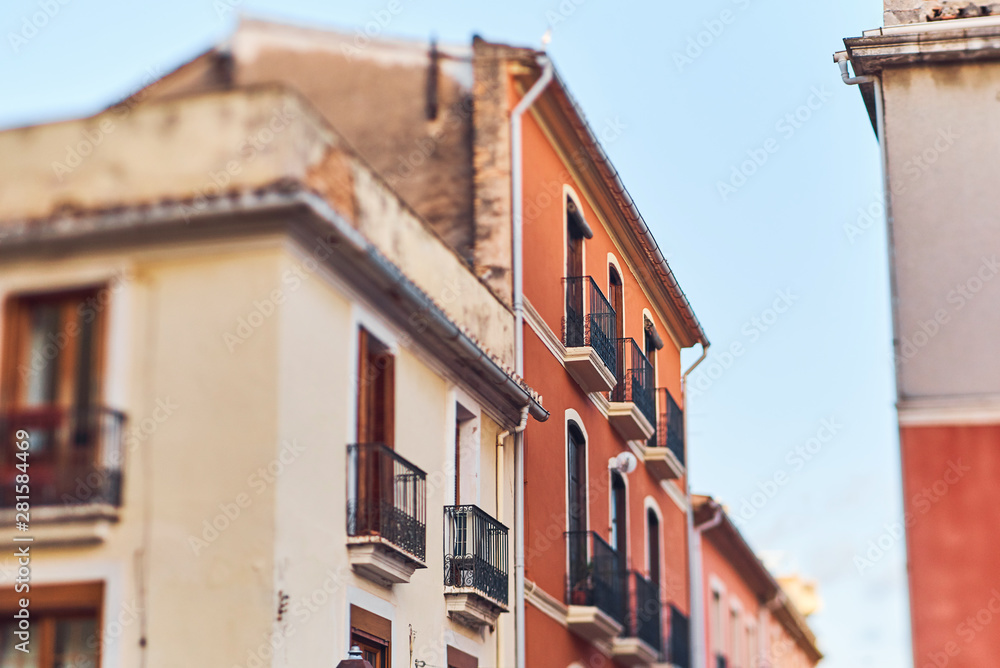 DENIA, SPAIN - JUNE 19, 2019: Old town of Denia with narrow streets and coloured houses.