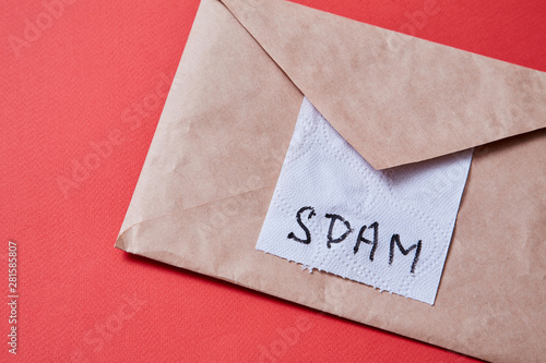 Junk mail or spam e-mail and unsolicited letter idea. Piece of toilet paper and envelope photo