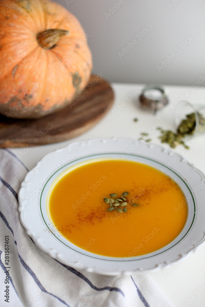 pumpkin soup puree on light background pumpkin soup puree on light background