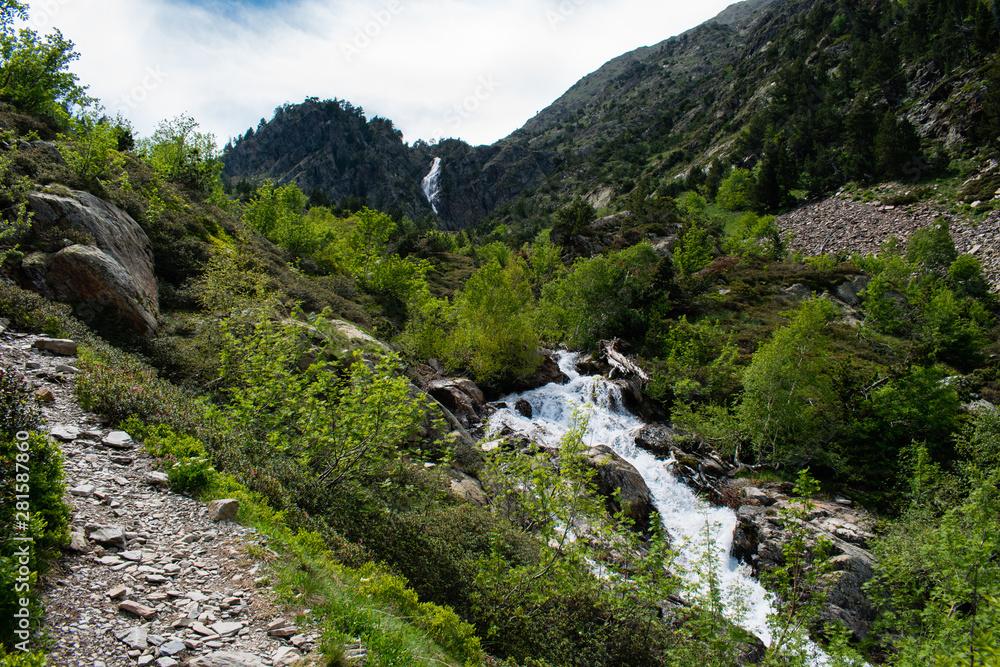 Landscape with waterfall in the mountains in summer at Parc Natural del Comapedrosa, Arinsal, Andorra Landscape with waterfall in the mountains in summer at Parc Natural del Comapedrosa, Arinsal, Andorra