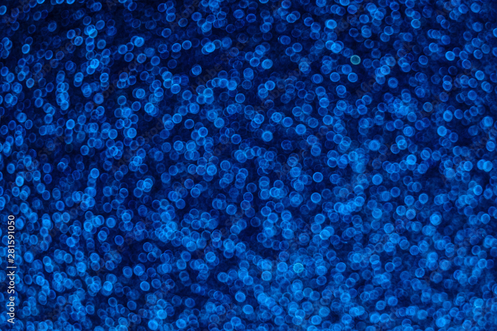 Holiday dark blue bokeh background with rings of sparkles light Holiday dark blue bokeh background with rings of sparkles light