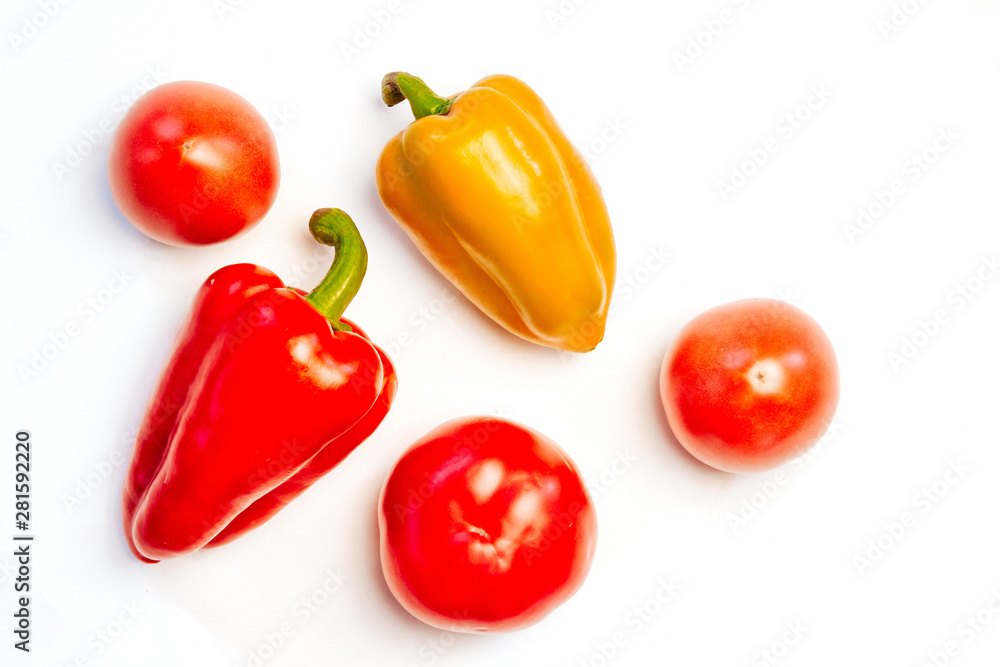 yellow and red peppers and tomatoes on a white background yellow and red peppers and tomatoes on a white background