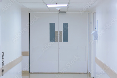 Wallpaper Mural A huge white door in the white corridor in the hospital. Torontodigital.ca