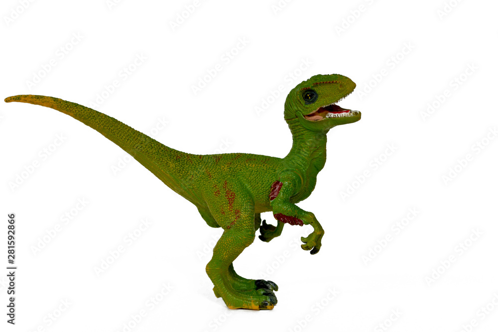 Fototapeta premium green dinosaur toy velociraptor with open mouth isolate