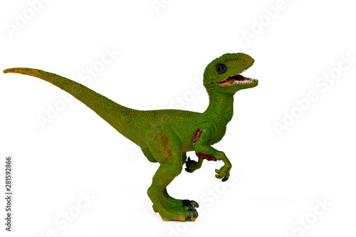 green dinosaur toy velociraptor with open mouth isolate © MARIIA CHIZHIK