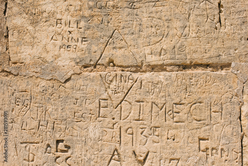 scribbled inscriptions on the wall on a building in Mdina Malta. Vandalism