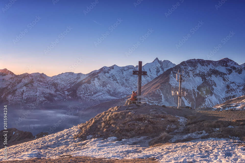 Scenic nature winter landscape with cross, on the top of the Schareck peak, Alps mountain range, outdoor travel background, Hohe Tauern national park, Carinthia, Austria