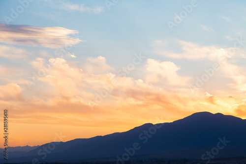 soft sunset sky. pink and gold clouds. High mountains. Natural background.