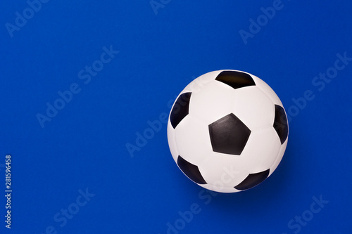 Soccer ball or football on blue background