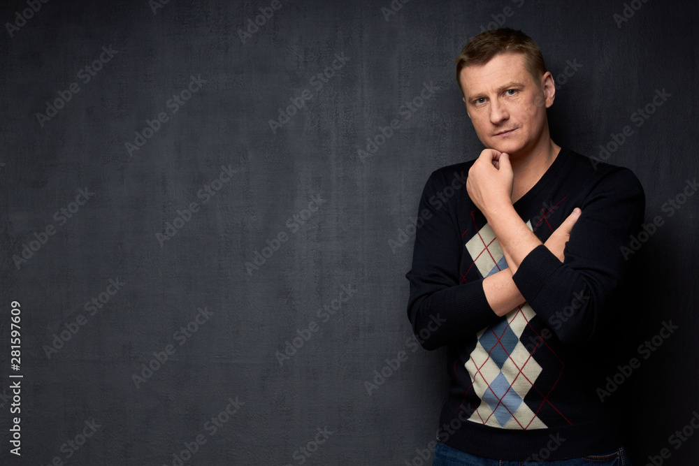 Portrait of confident man touching chin with hand Portrait of confident man touching chin with hand