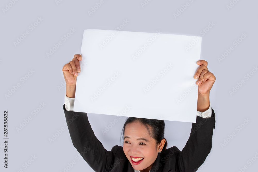 Business person holding a blank white paper in hand. Business person holding a blank white paper in hand.