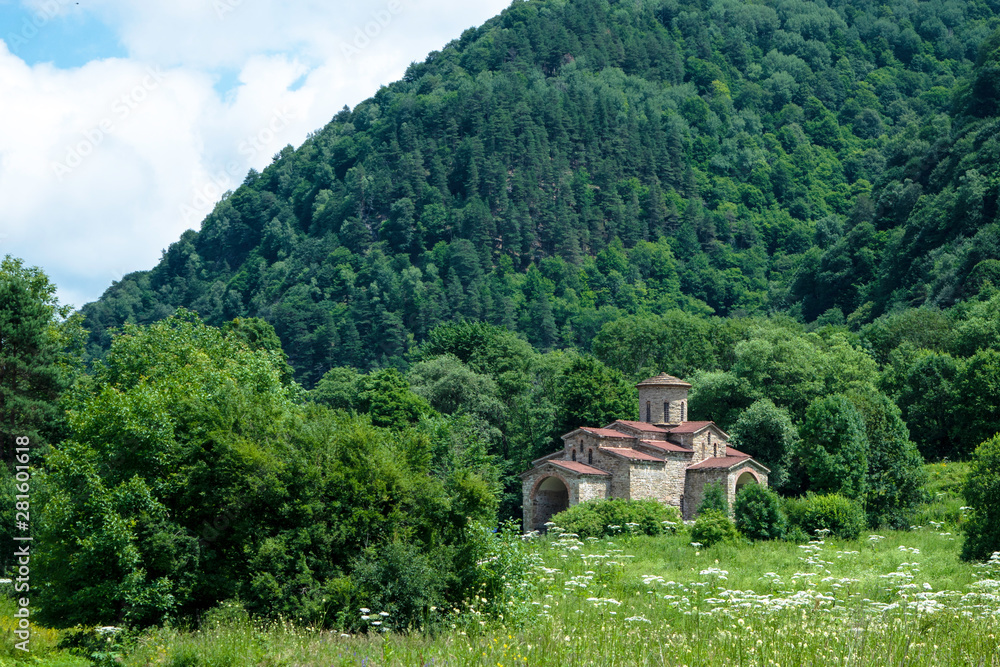 10th century ancient Christian church, Nizhnearhizy temples, Northern Zelenchuk temple, stone temple among mountains and vegetation 10th century ancient Christian church, Nizhnearhizy temples, Northern Zelenchuk temple, stone temple among mountains and vegetation