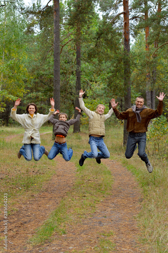 Portrait of family of four in park Portrait of family of four in park