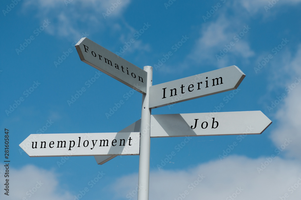Closeup of destination panels with different career choices on cloudy sky background Closeup of destination panels with different career choices on cloudy sky background