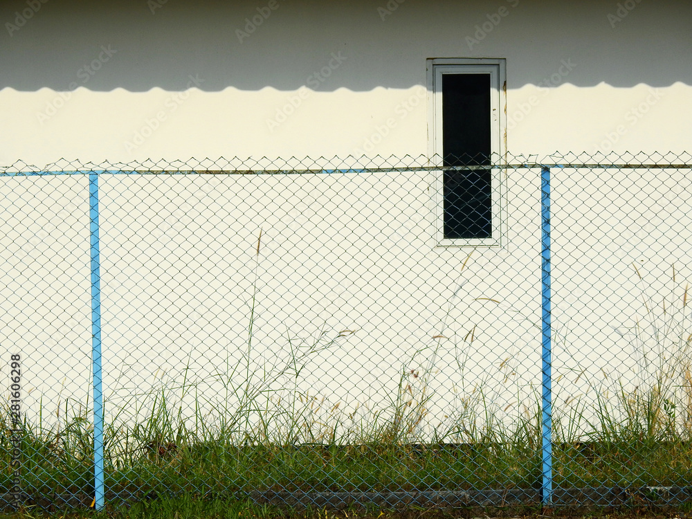 Fototapeta premium wire mesh of fence in abandoned place