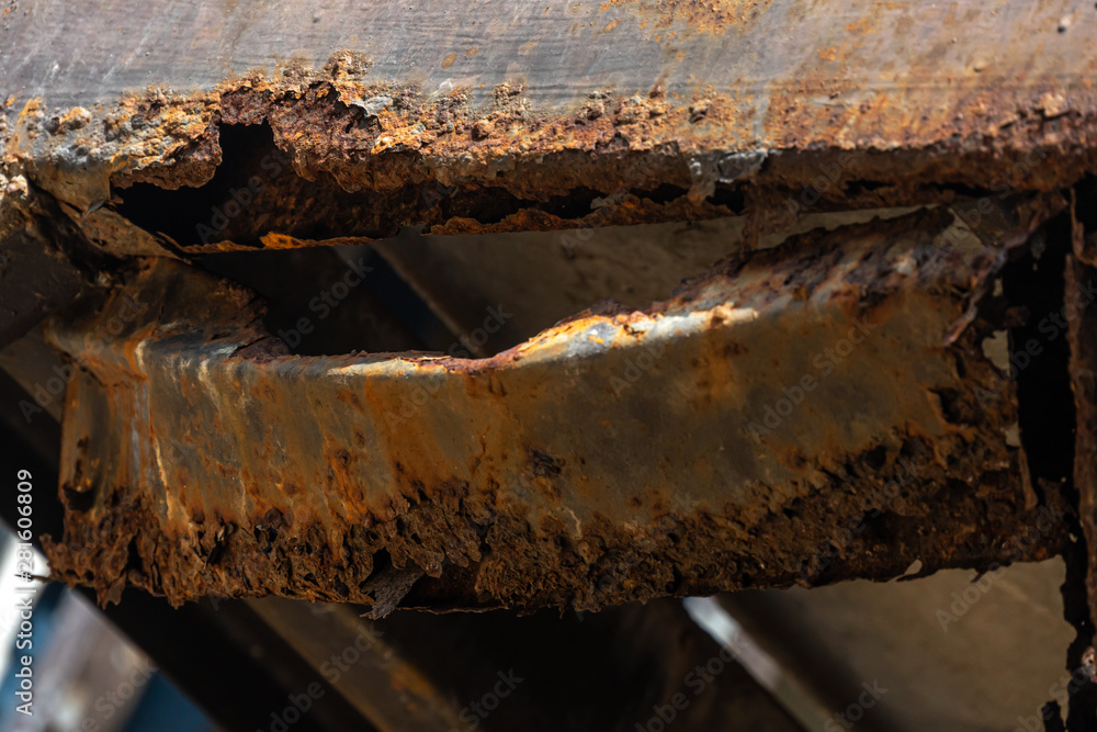 Rust on steel structural columns & post floor support. Rust on steel structural columns & post floor support.