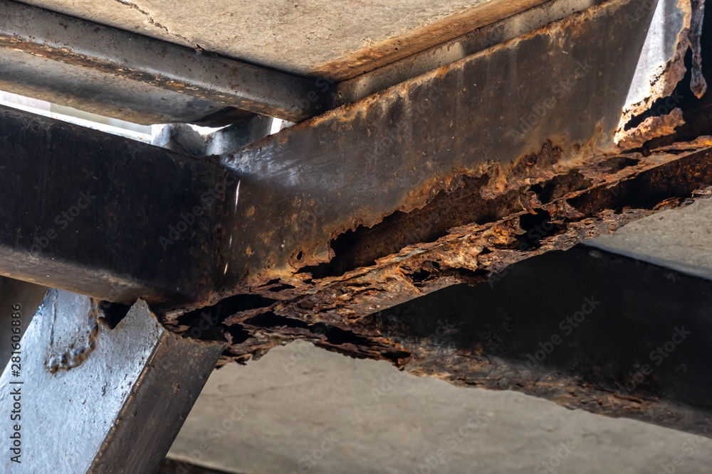 Rust on steel structural columns & post floor support.