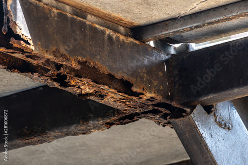 Rust on steel structural columns & post floor support.