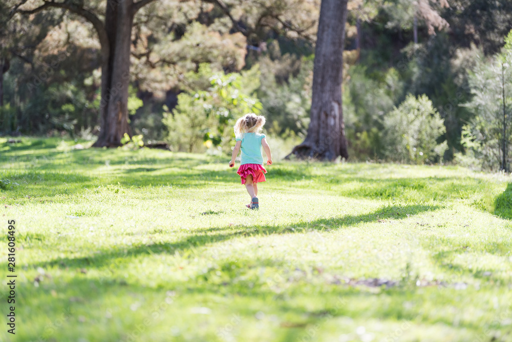 young girl running in the park young girl running in the park