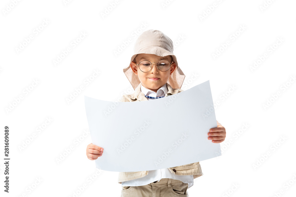 focused explorer child in glasses and hat looking at placard isolated on white focused explorer child in glasses and hat looking at placard isolated on white