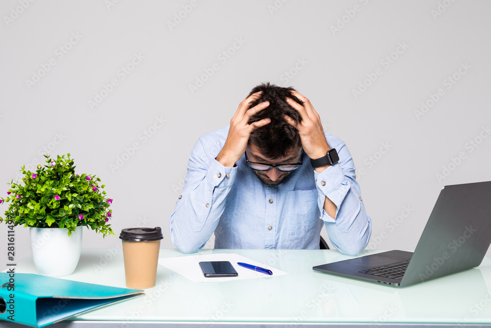 Young business man with problems and stress in the office Young business man with problems and stress in the office