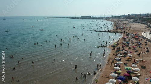 another flying backward along beach of Marina di Ragusa Sicily photo