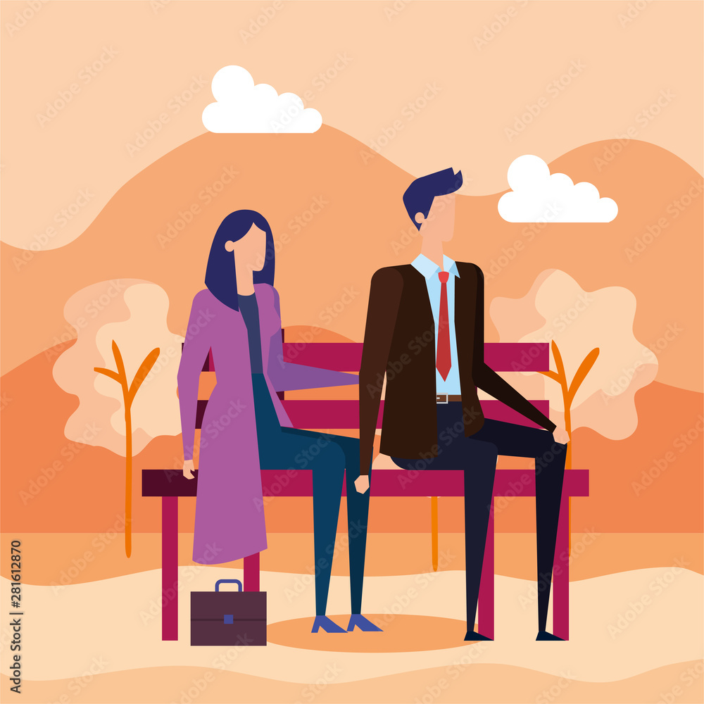 elegant business couple seated in the park chair elegant business couple seated in the park chair