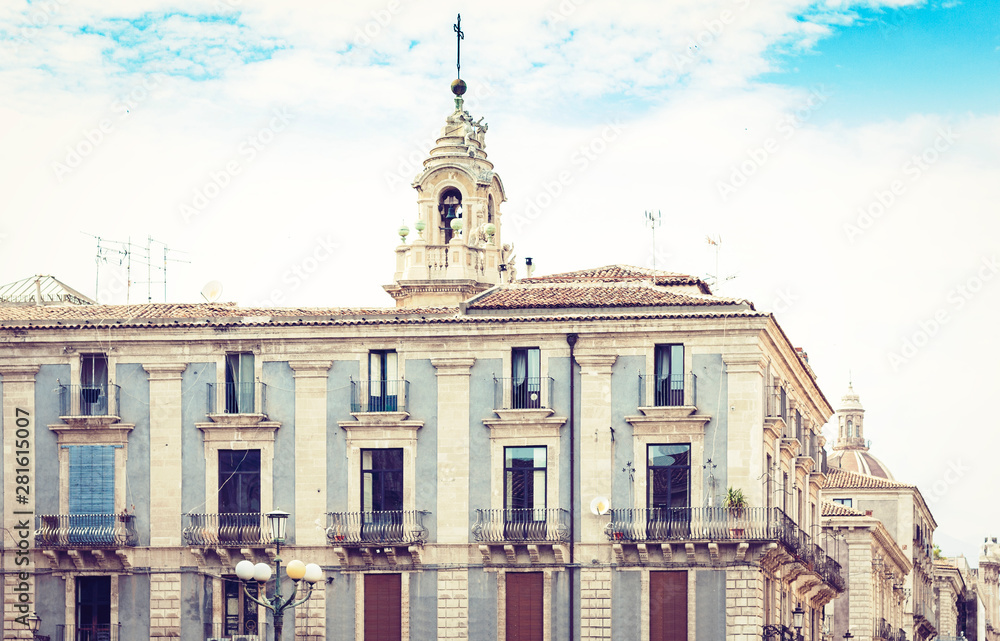 Fototapeta premium Traditional architecture of Sicily in Italy, typical street of Catania, facade of old buildings.