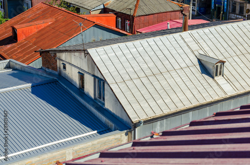 Roofs of different shapes and colors